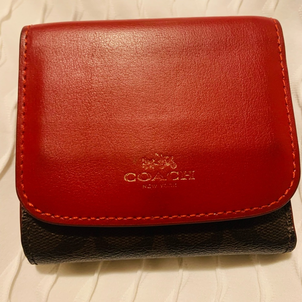 Red and brown coach trifold wallet